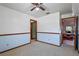 Another bedroom featuring carpet, ceiling fan and a view to the living area at 1032 Silcox Branch Cir, Oviedo, FL 32765