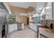 Bright kitchen with white cabinets, stainless steel appliances, and open layout at 1032 Silcox Branch Cir, Oviedo, FL 32765