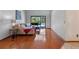 Bright living room with hardwood floors, couch and views of the lanai and pool at 1032 Silcox Branch Cir, Oviedo, FL 32765