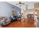 Spacious living room with an open layout, hardwood floors, and ample seating at 1032 Silcox Branch Cir, Oviedo, FL 32765