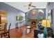 Inviting living room with fireplace, vaulted ceiling, and lots of natural light at 1032 Silcox Branch Cir, Oviedo, FL 32765