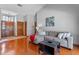 Spacious living room featuring hardwood floors, natural light, and comfortable seating at 1032 Silcox Branch Cir, Oviedo, FL 32765