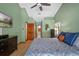 Spacious bedroom with wood laminate flooring and ensuite bath at 1032 Silcox Branch Cir, Oviedo, FL 32765