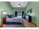 Comfortable main bedroom with backyard views, ceiling fan, and wood laminate flooring at 1032 Silcox Branch Cir, Oviedo, FL 32765