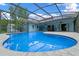 Relaxing pool with a screened enclosure, perfect for outdoor enjoyment at 1032 Silcox Branch Cir, Oviedo, FL 32765