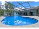 Relaxing pool with a screened enclosure, perfect for outdoor enjoyment at 1032 Silcox Branch Cir, Oviedo, FL 32765