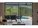 View of private pool area from the lanai, featuring a dining set and screened enclosure at 1032 Silcox Branch Cir, Oviedo, FL 32765