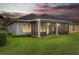 A beautiful screened-in patio extends from this single Gathering home into a large grassy backyard at 1035 Stoney Creek Dr, Lakeland, FL 33811