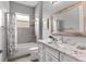 Bathroom features a shower-tub combination, and a vanity with a granite countertop at 1035 Stoney Creek Dr, Lakeland, FL 33811