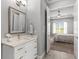 Bathroom features a vanity with granite countertop, and a doorway leading into the main bedroom at 1035 Stoney Creek Dr, Lakeland, FL 33811