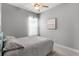 Bedroom with neutral walls, a ceiling fan, and a window with sheer curtains and blinds at 1035 Stoney Creek Dr, Lakeland, FL 33811