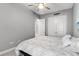 Bedroom includes a ceiling fan, and closet doors, offering functionality and style at 1035 Stoney Creek Dr, Lakeland, FL 33811