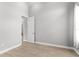 Bright bedroom features hardwood floors and a neutral color scheme, creating a serene retreat at 1035 Stoney Creek Dr, Lakeland, FL 33811