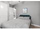 Bedroom with a neutral gray color, standard closet and a picture hanging on the wall at 1035 Stoney Creek Dr, Lakeland, FL 33811