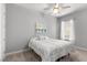 Bedroom with neutral walls, a ceiling fan, and a window with sheer curtains and blinds at 1035 Stoney Creek Dr, Lakeland, FL 33811