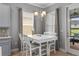 Cozy breakfast nook featuring a white table, natural light and adjacent outdoor patio access at 1035 Stoney Creek Dr, Lakeland, FL 33811