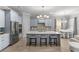 Beautiful kitchen island with seating, stainless appliances, and elegant light fixtures creating a stylish and functional space at 1035 Stoney Creek Dr, Lakeland, FL 33811