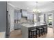 This modern kitchen features stainless steel appliances, an island with bar seating, and lots of natural light at 1035 Stoney Creek Dr, Lakeland, FL 33811