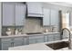 Close up of the kitchen featuring stainless steel appliances and custom cabinetry with a beautiful backsplash at 1035 Stoney Creek Dr, Lakeland, FL 33811