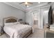 Cozy main bedroom with a plush bed, tray ceiling, and an en-suite bathroom for added convenience at 1035 Stoney Creek Dr, Lakeland, FL 33811