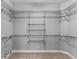 Spacious walk-in closet with multiple levels of wire shelving to maximize storage space at 1035 Stoney Creek Dr, Lakeland, FL 33811