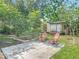 This backyard features a large patio and two lounge chairs at 1089 Algoma St, Deltona, FL 32725