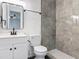 Modern bathroom with stylish vanity, gray marble-look shower, and updated fixtures at 1089 Algoma St, Deltona, FL 32725