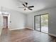 Spacious bedroom with hardwood floors and a sliding glass door to the backyard at 1089 Algoma St, Deltona, FL 32725