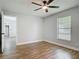 Bedroom featuring wood-look flooring and a bright window offering views of the outdoors at 1089 Algoma St, Deltona, FL 32725