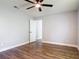 Bedroom with wood-look floors, ceiling fan, and neutral paint for a serene atmosphere at 1089 Algoma St, Deltona, FL 32725