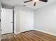 This bedroom features hard wood flooring, a ceiling fan, closet space, and a bright interior at 1089 Algoma St, Deltona, FL 32725
