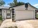 Close-up of a charming single-story home with an attached garage at 1089 Algoma St, Deltona, FL 32725