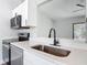 Kitchen featuring quartz countertop, stainless steel appliances, and modern fixtures at 1089 Algoma St, Deltona, FL 32725