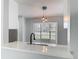 Modern kitchen featuring quartz countertops, stainless steel appliances, and hardwood floors at 1089 Algoma St, Deltona, FL 32725