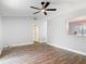 Spacious living area showcasing wood-look floors, vaulted ceiling, and lots of natural light at 1089 Algoma St, Deltona, FL 32725