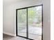 Sliding glass doors overlook private backyard patio and garden at 1089 Algoma St, Deltona, FL 32725