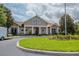 Beautiful community clubhouse features well-maintained landscaping and a welcoming circular driveway at 13940 Magnolia Ridge Loop, Winter Garden, FL 34787