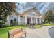 Charming clubhouse with manicured landscaping, benches, and convenient bicycle parking at 13940 Magnolia Ridge Loop, Winter Garden, FL 34787
