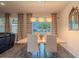 Bright dining area featuring a modern chandelier and views of the outdoor space at 13940 Magnolia Ridge Loop, Winter Garden, FL 34787