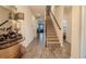 Hallway featuring wood-look tile flooring, elegant decor, and staircase at 13940 Magnolia Ridge Loop, Winter Garden, FL 34787