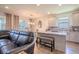 Open-concept kitchen with a breakfast bar, stainless steel appliances, and seamless access to dining area at 13940 Magnolia Ridge Loop, Winter Garden, FL 34787