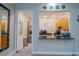 Bright kitchen area with sleek countertops, modern appliances, and ample storage at 13940 Magnolia Ridge Loop, Winter Garden, FL 34787