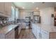 Well-equipped kitchen with stainless steel appliances, granite countertops and a large island at 13940 Magnolia Ridge Loop, Winter Garden, FL 34787