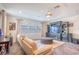 Comfortable living room with a large entertainment center and modern furnishings at 13940 Magnolia Ridge Loop, Winter Garden, FL 34787