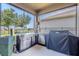 Outdoor kitchen with stainless steel grill and prep area, perfect for entertaining at 13940 Magnolia Ridge Loop, Winter Garden, FL 34787