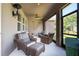 Relaxing screened patio featuring comfortable seating and stylish decor at 13940 Magnolia Ridge Loop, Winter Garden, FL 34787