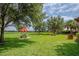 Lush green picnic area with picnic tables and umbrellas for outdoor enjoyment at 13940 Magnolia Ridge Loop, Winter Garden, FL 34787