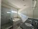 Bathroom features a double sink vanity, granite counters, shower and large bathtub at 14117 Larkspur Lake Dr, Winter Garden, FL 34787