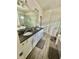 Bathroom features a double sink vanity, granite counters, and large mirror and walk in shower at 14117 Larkspur Lake Dr, Winter Garden, FL 34787