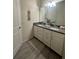 Bathroom features granite counters, large mirror and plenty of storage space at 14117 Larkspur Lake Dr, Winter Garden, FL 34787